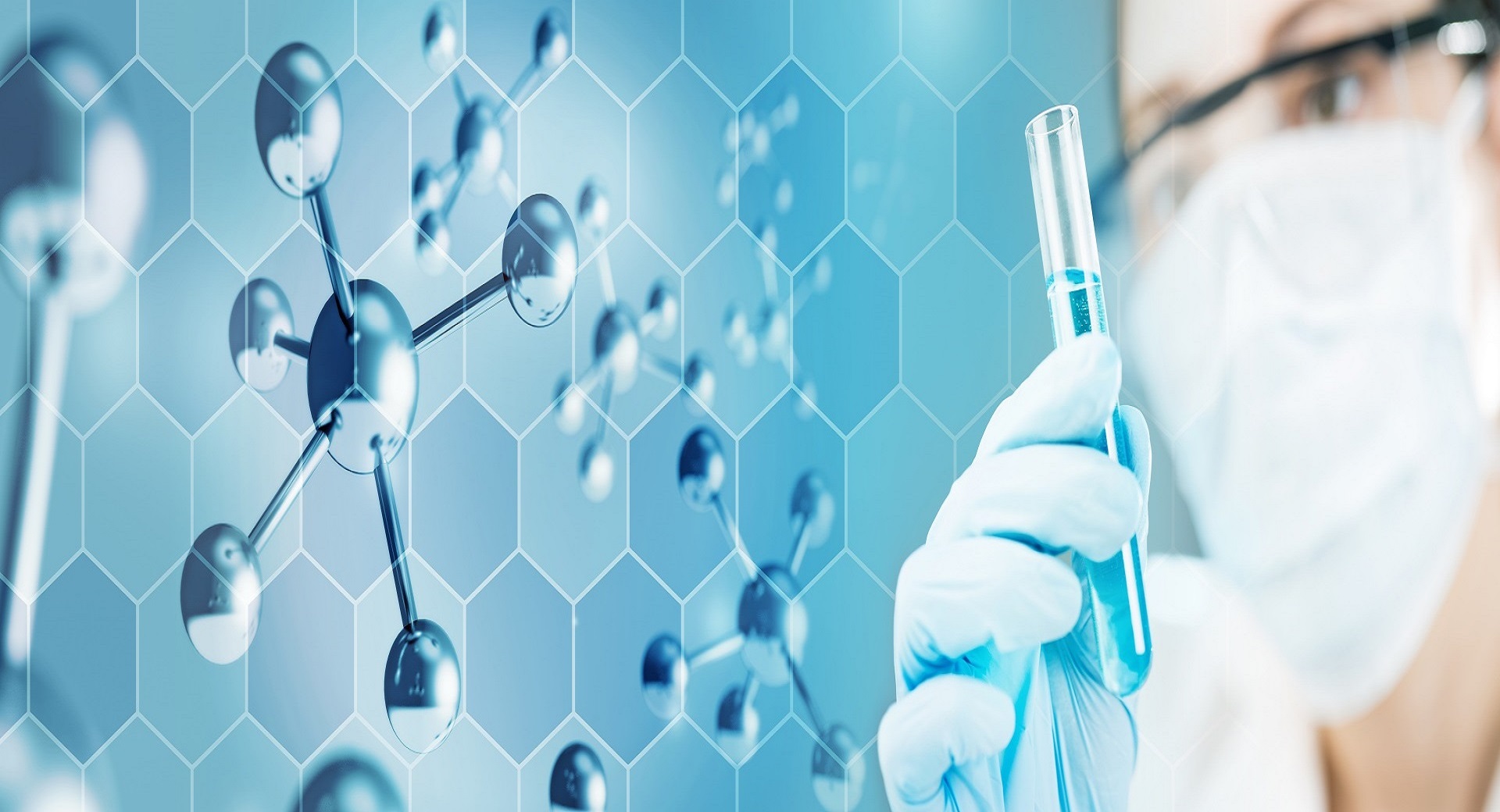 Laboratory technician holding a test tube against a molecular diagram